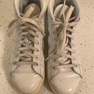 Stan Smith high top embossed sneakers